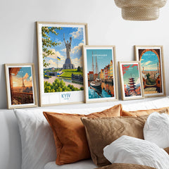 Kyiv Ukraine Spring Blossom Wall Art — the Motherland Monument under spring blossom with the Ukrainian flag flying, shown as set five framed artprints above bed natural wood frames