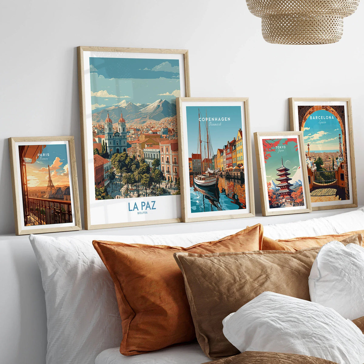 La Paz Bolivia Wall Art Poster - Bolivian Capital Travel Decor in a gallery wall set of five framed travel prints in natural wood frames above a bed