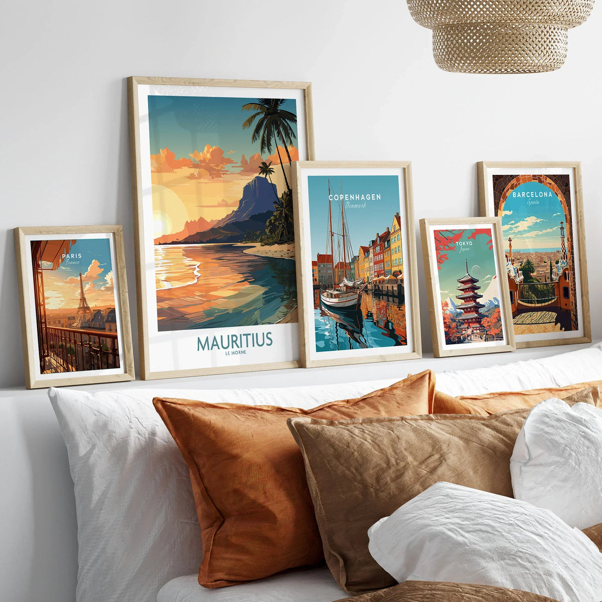 Le Morne Mauritius Wall Art in a gallery wall set of five framed travel prints in natural wood frames above a bed
