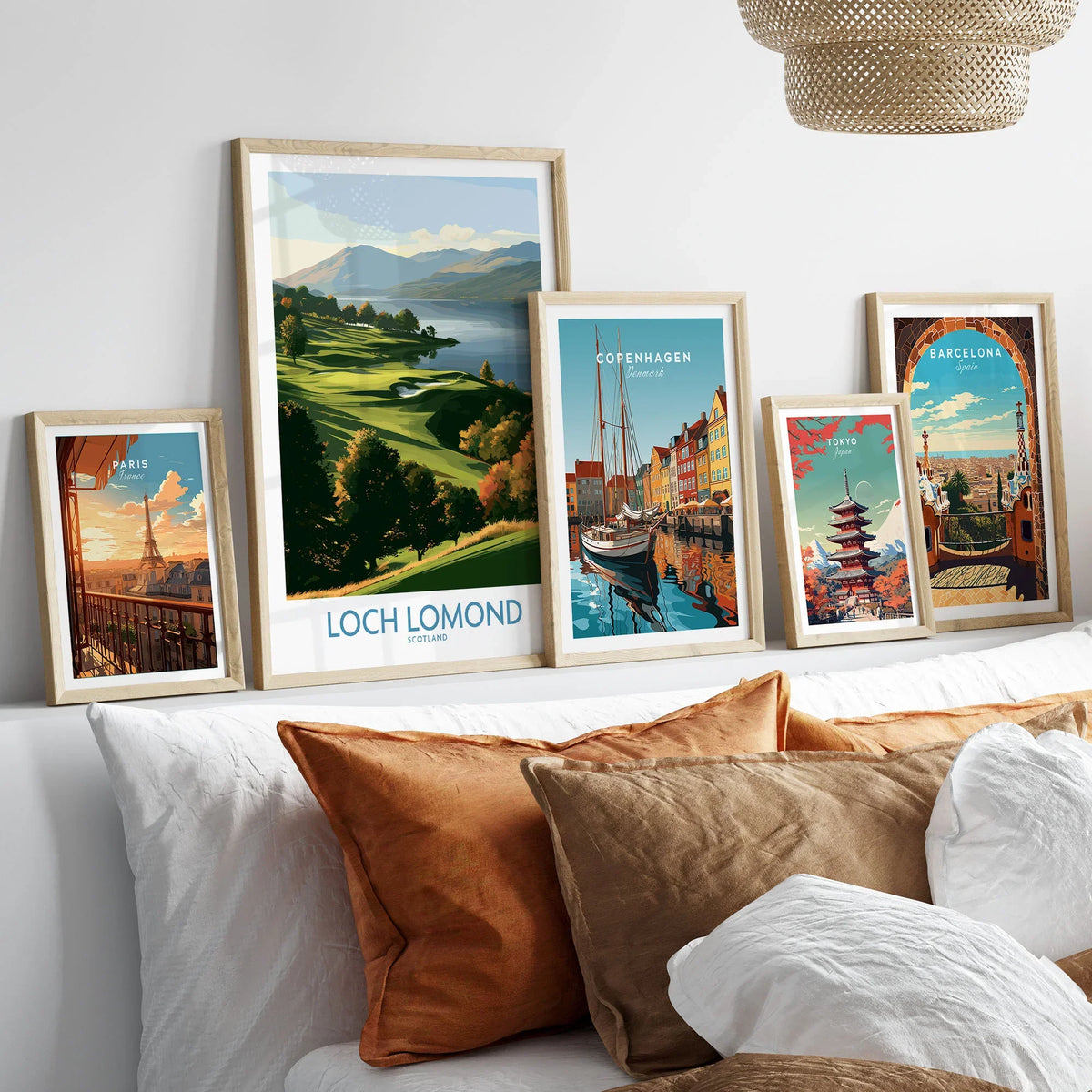 Loch Lomond Scotland Highland View Wall Art — autumn slopes rolling down to Loch Lomond with Highland hills beyond, shown as set five framed artprints above bed natural wood frames