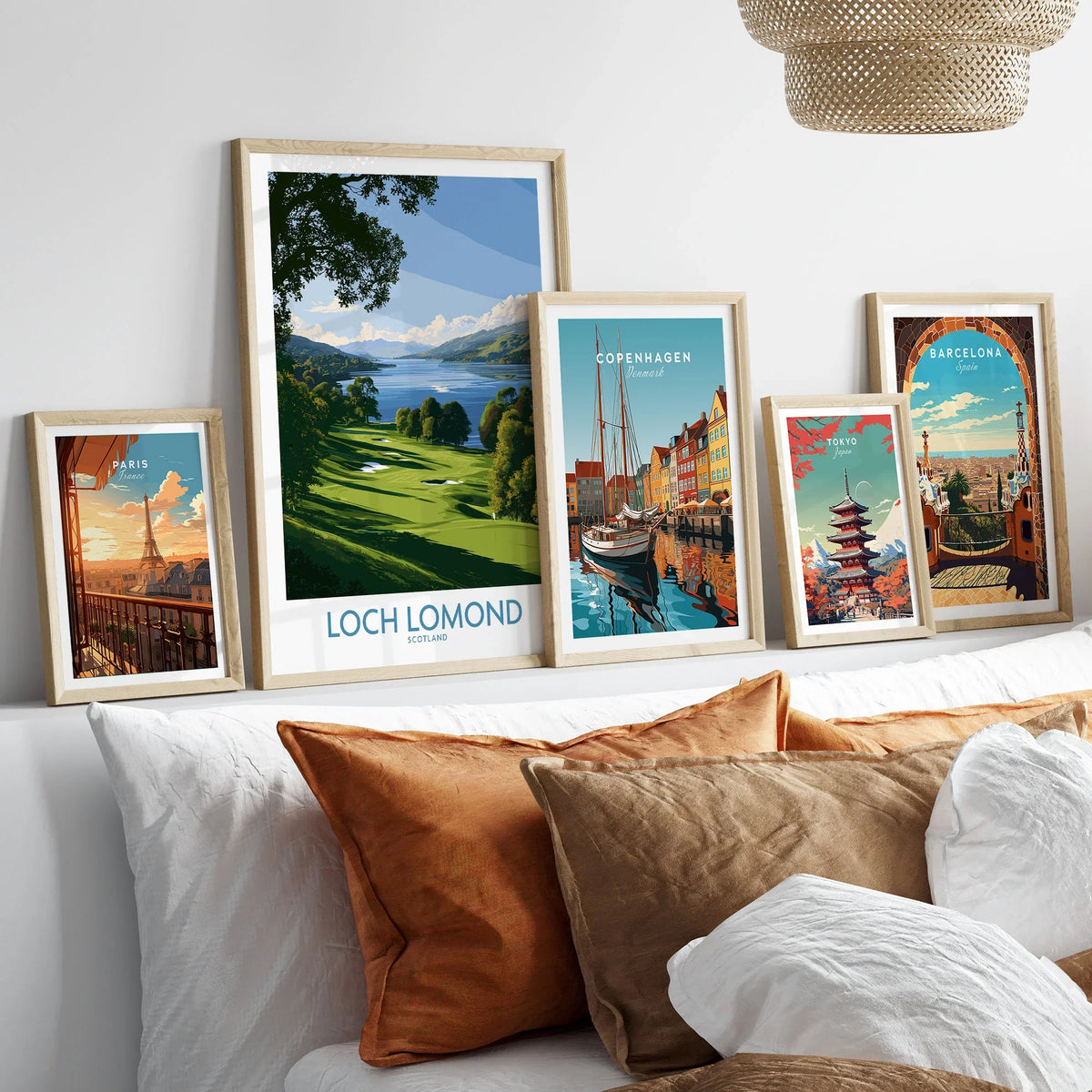 Loch Lomond Scotland Lochside Meadow Wall Art — a sunlit grassy shoreline running down to Loch Lomond under old oaks, shown as set five framed artprints above bed natural wood frames