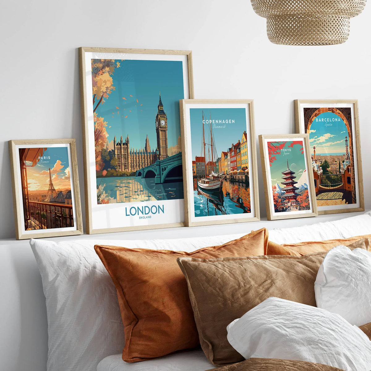 London Big Ben Wall Art | Modern Style in a gallery wall set of five framed travel prints in natural wood frames above a bed