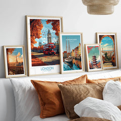 London Travel Poster in a gallery wall set of five framed travel prints in natural wood frames above a bed
