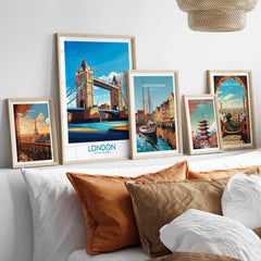 London Poster England in a gallery wall set of five framed travel prints in natural wood frames above a bed