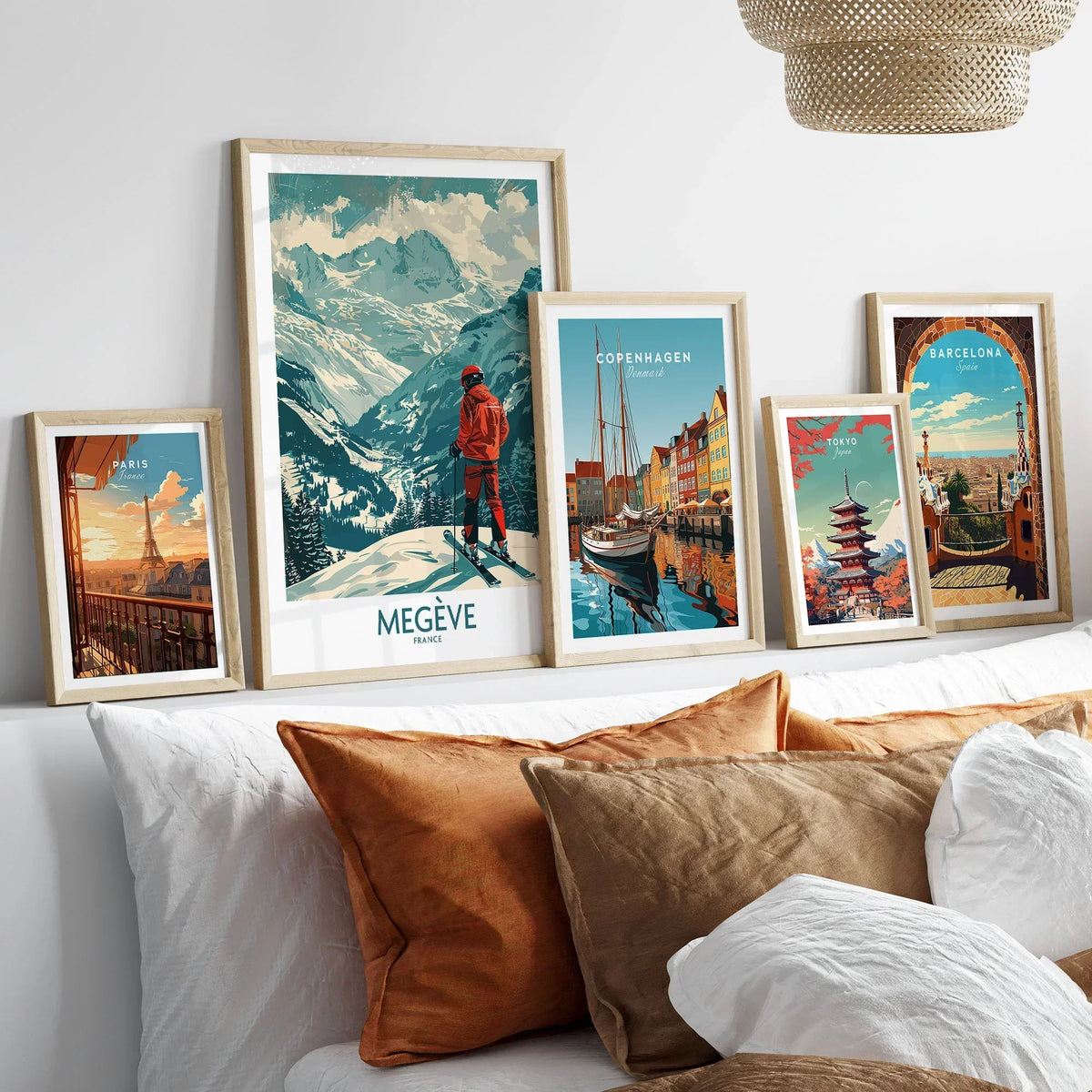 Megève Wall Art - France in a gallery wall set of five framed travel prints in natural wood frames above a bed