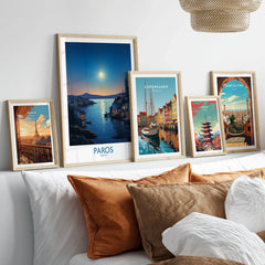 Paros Poster Greece in a gallery wall set of five framed travel prints in natural wood frames above a bed