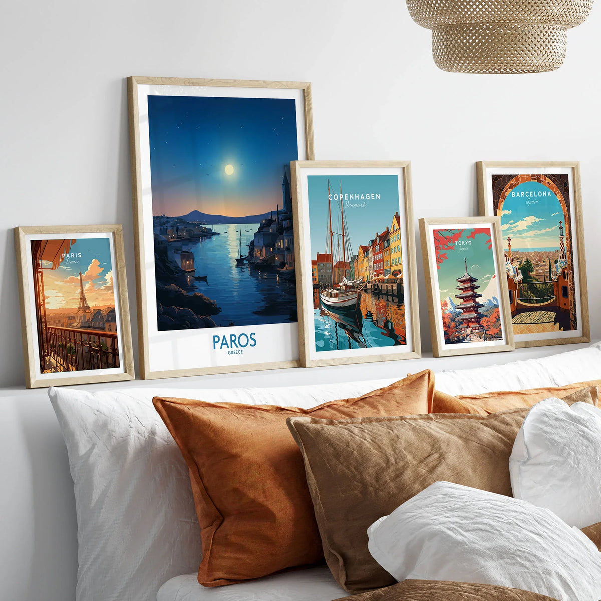 Paros Poster Greece in a gallery wall set of five framed travel prints in natural wood frames above a bed