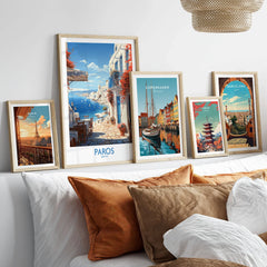 Paros Wall Art Greece in a gallery wall set of five framed travel prints in natural wood frames above a bed