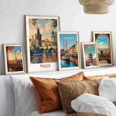 Prague Travel Poster in a gallery wall set of five framed travel prints in natural wood frames above a bed
