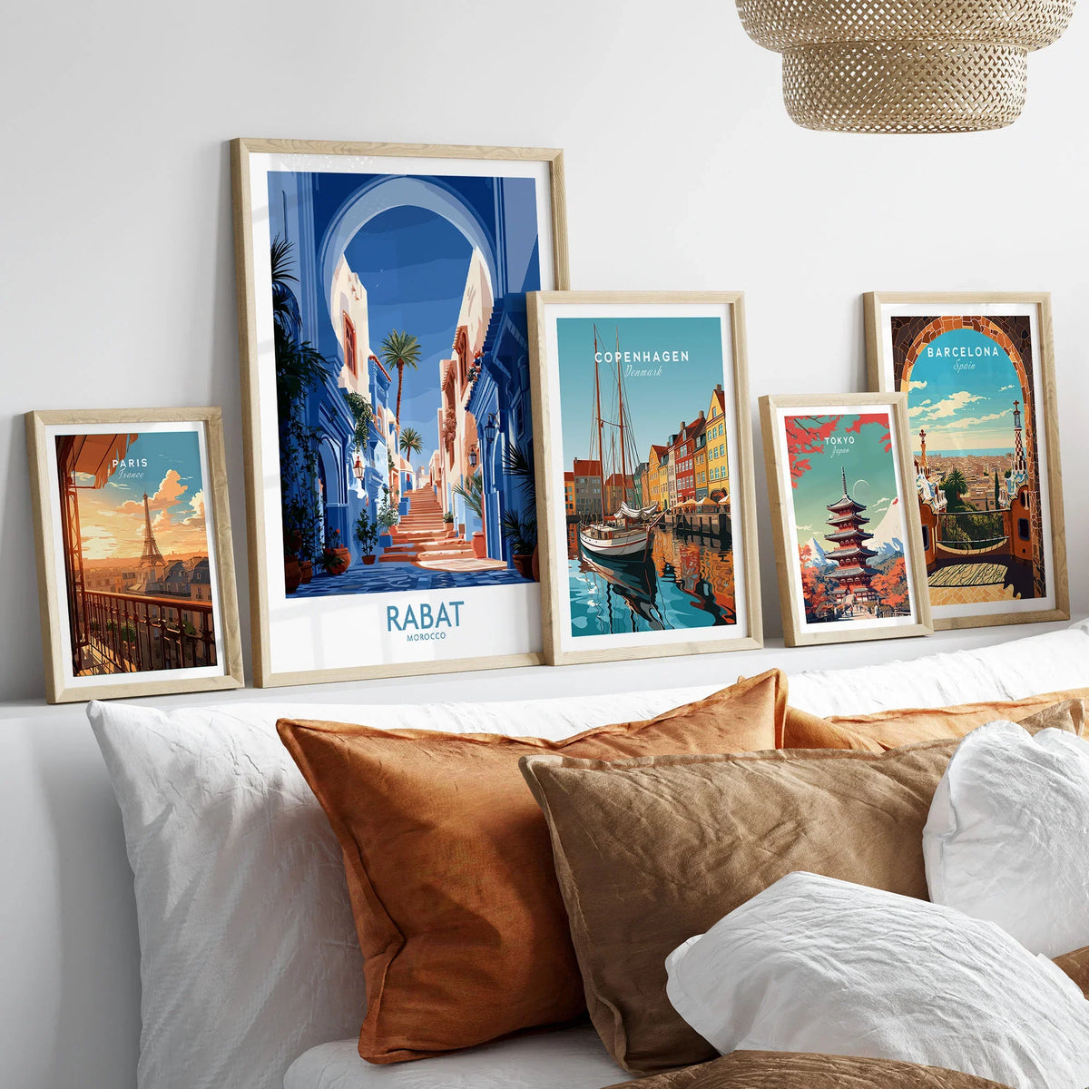 Rabat Morocco Blue Alleyway Wall Art — a blue-washed medina lane and stone steps seen through a horseshoe arch, shown as set five framed artprints above bed natural wood frames