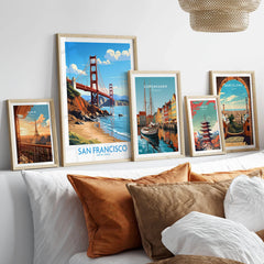 San Francisco Poster in a gallery wall set of five framed travel prints in natural wood frames above a bed