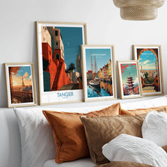 Tangier Morocco Crescent Moon Wall Art — coral kasbah steps climbing towards a minaret under a crescent moon, shown as set five framed artprints above bed natural wood frames