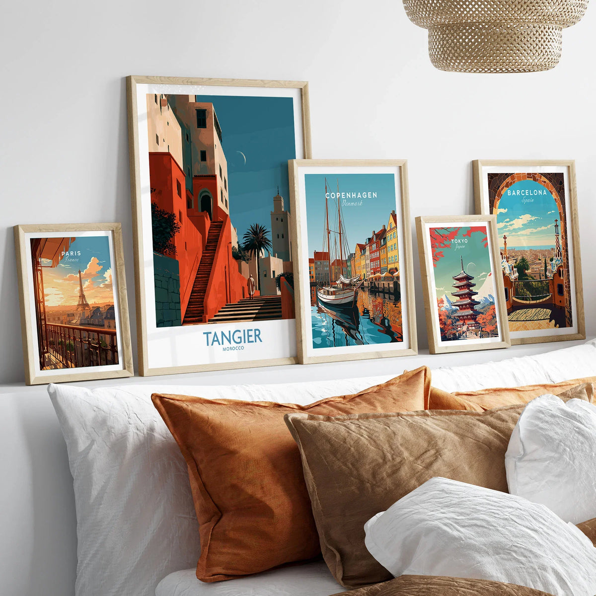 Tangier Morocco Crescent Moon Wall Art — coral kasbah steps climbing towards a minaret under a crescent moon, shown as set five framed artprints above bed natural wood frames
