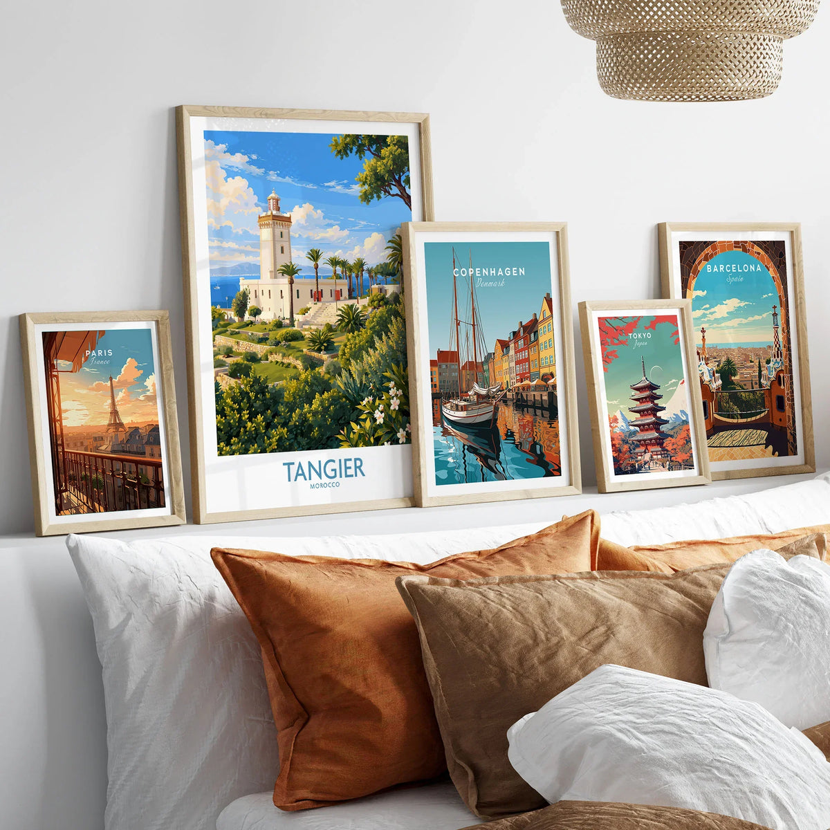 Tangier Morocco Lighthouse Gardens Wall Art — the Cap Spartel lighthouse above palm gardens and the blue strait, shown as set five framed artprints above bed natural wood frames