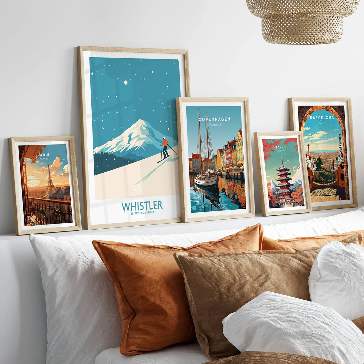 Whistler Wall Art Print -  British Columbia in a gallery wall set of five framed travel prints in natural wood frames above a bed