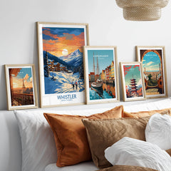 Whistler Print in a gallery wall set of five framed travel prints in natural wood frames above a bed