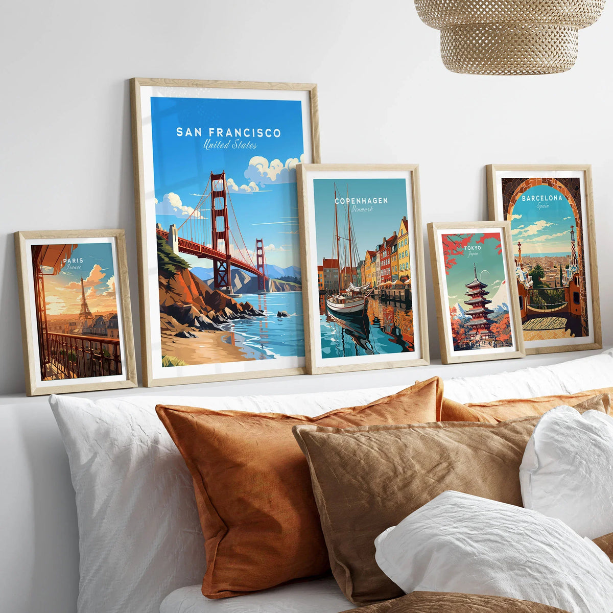 San Francisco Print in a gallery wall set of five framed travel prints in natural wood frames above a bed