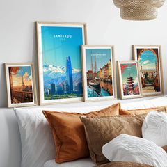 Santiago Travel Poster - Chile in a gallery wall set of five framed travel prints in natural wood frames above a bed