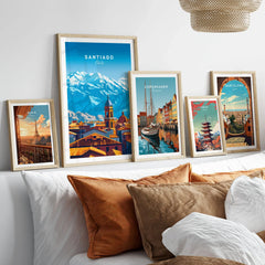 Santiago Travel Print - Chile Poster in a gallery wall set of five framed travel prints in natural wood frames above a bed