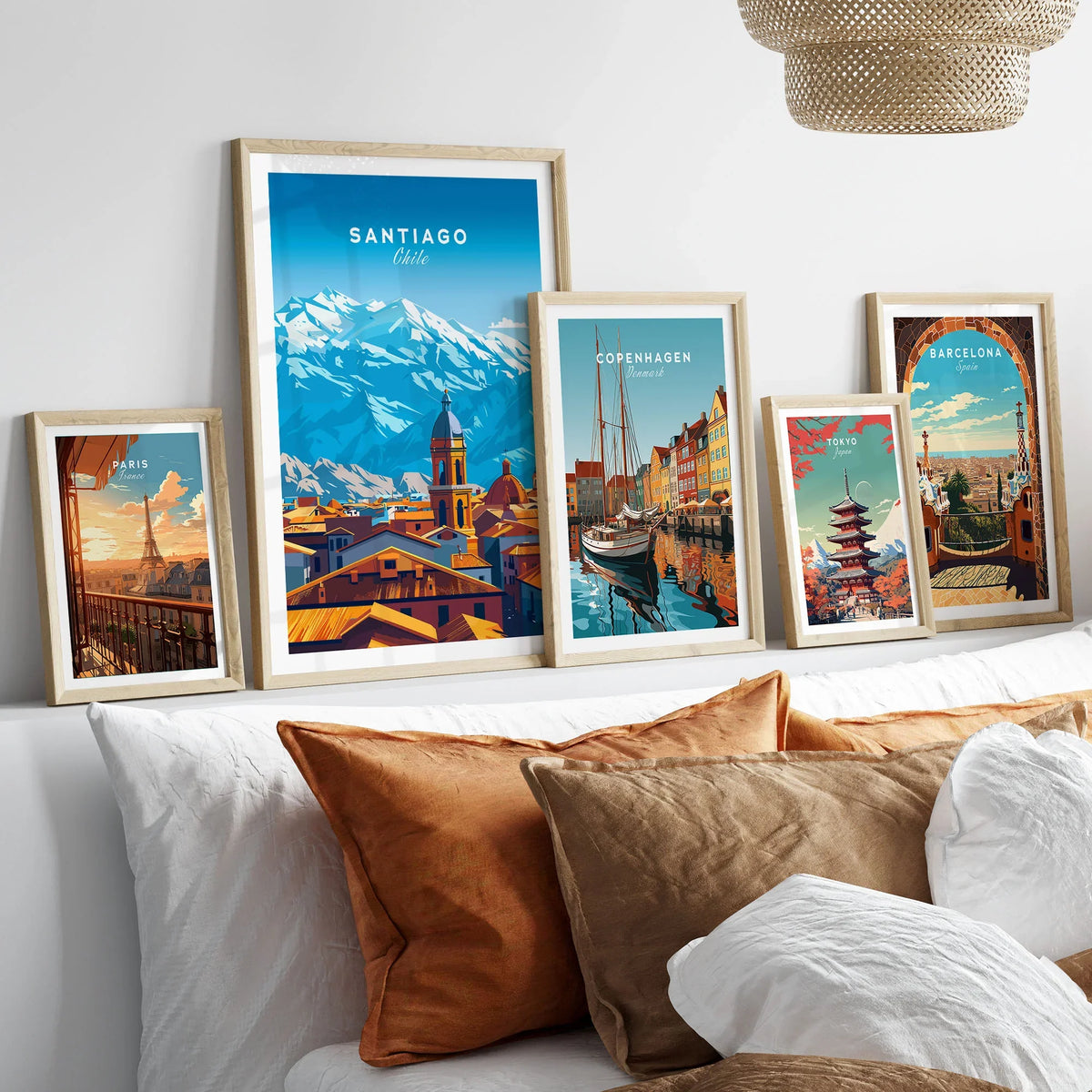 Santiago Travel Print - Chile Poster in a gallery wall set of five framed travel prints in natural wood frames above a bed