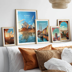 Sydney Poster Australia in a gallery wall set of five framed travel prints in natural wood frames above a bed