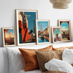 Tangier Morocco Kasbah Steps Travel Poster — coral kasbah steps climbing towards a minaret under a crescent moon, shown as set five framed artprints above bed natural wood frames