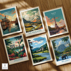 Set of six framed travel art prints on wooden floor, featuring Venice, Paris, The Highlands, Singapore, Balmoral Castle, and Sri Lanka landscapes.