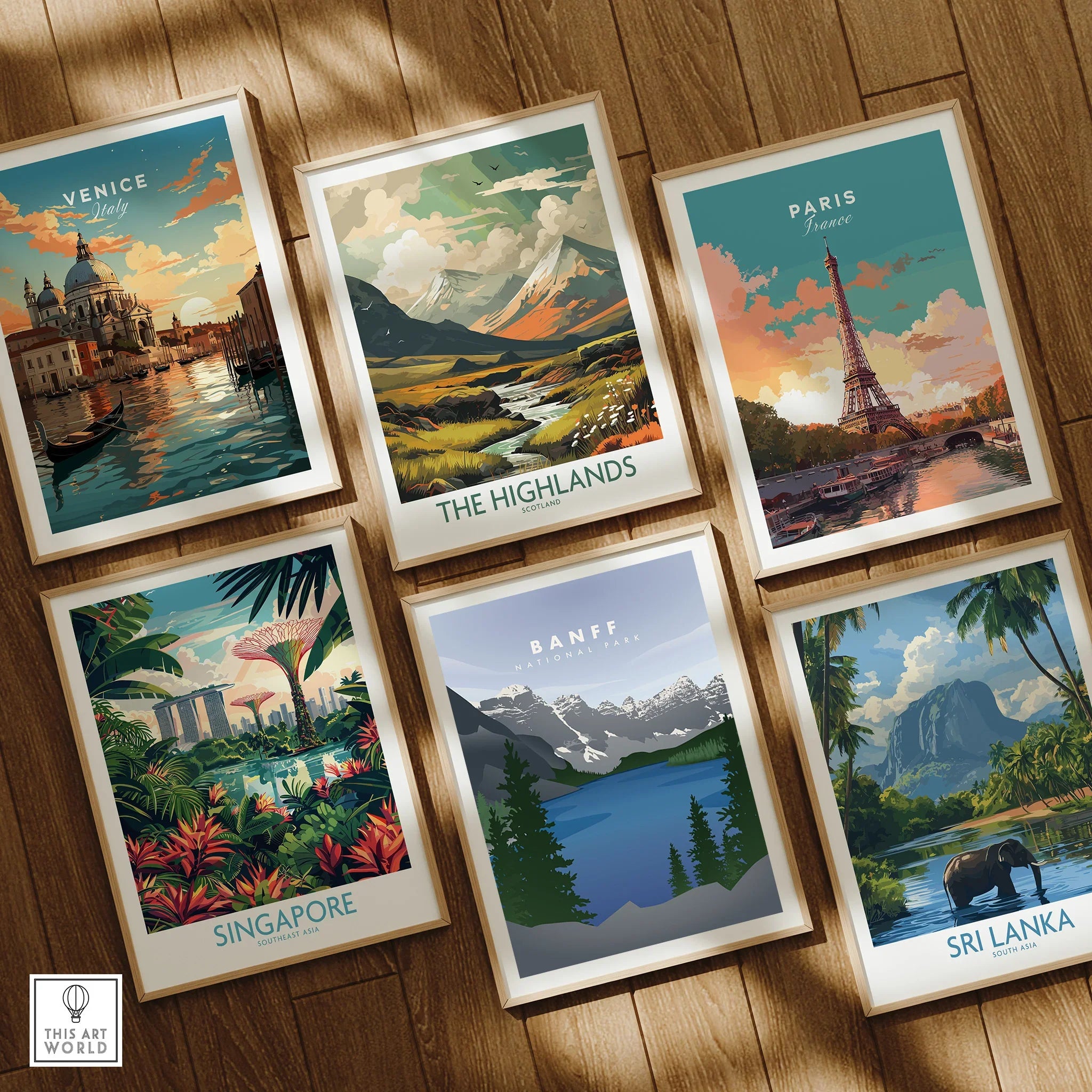 Set of six framed travel posters featuring landmarks and scenic landscapes on a wooden floor.
