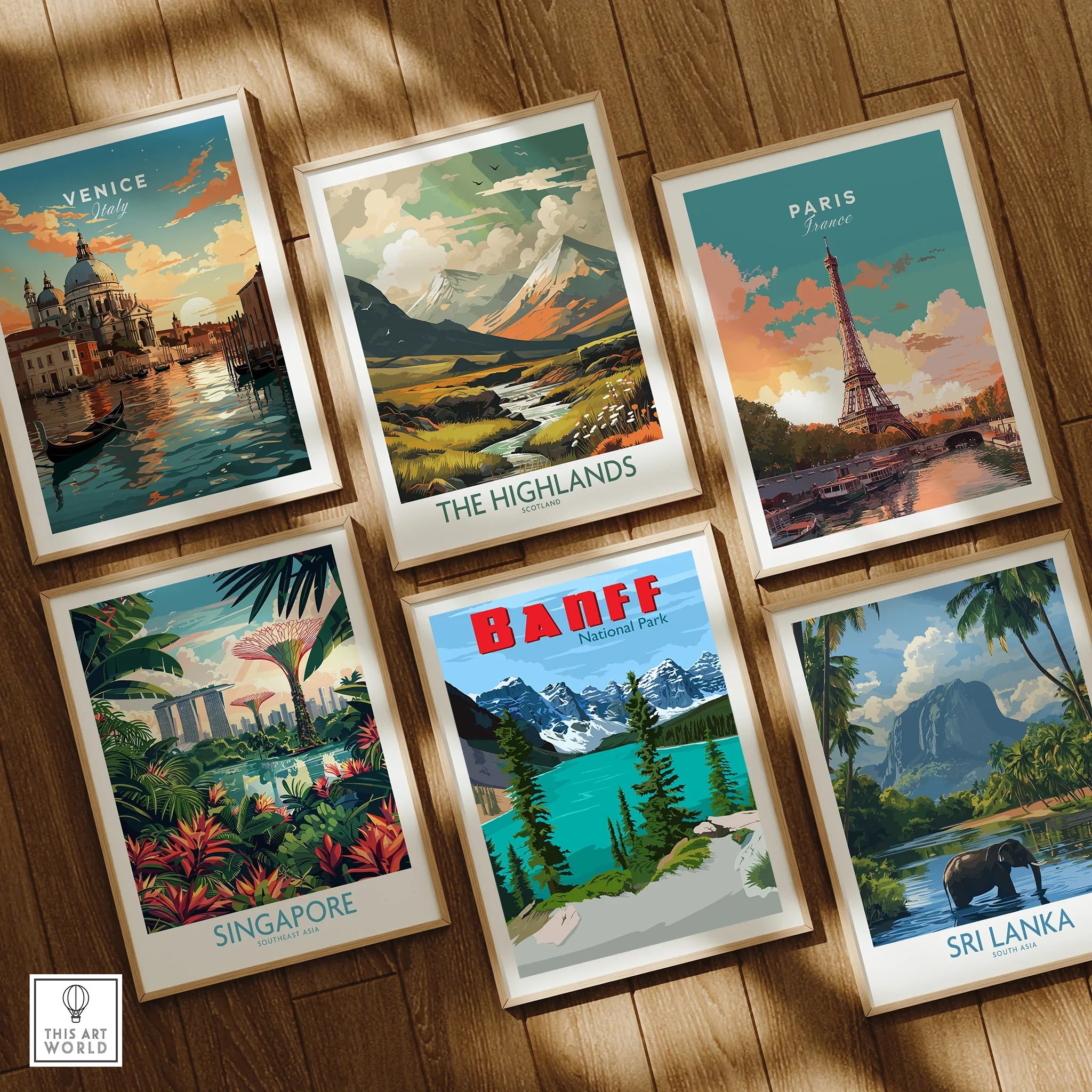 Set of six framed travel posters featuring Venice, Paris, Banff, Singapore, Highlands, Sri Lanka on wooden floor