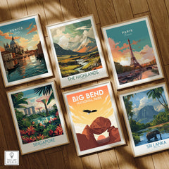 Set of six framed travel posters featuring Venice, Paris, Highlands, Singapore, Big Bend National Park, and Sri Lanka on a wooden floor.
