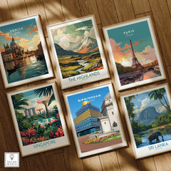 Set of six framed travel posters featuring Venice, Highlands, Paris, Singapore, Birmingham, and Sri Lanka on a wooden floor.