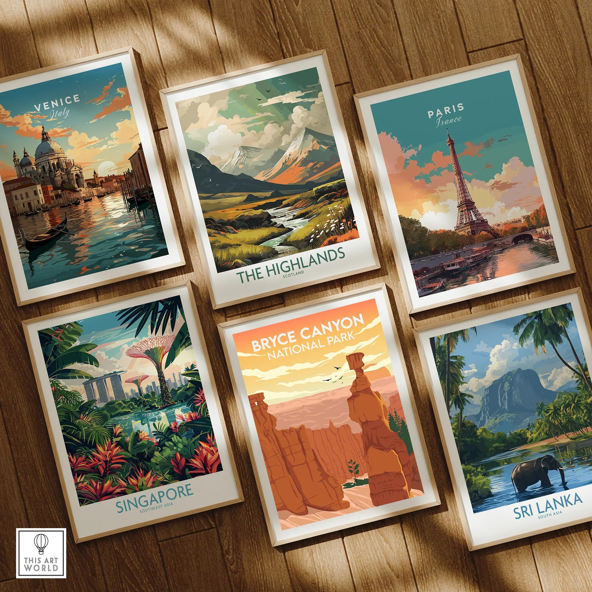 Set of six framed travel posters featuring Venice, Paris, Bryce Canyon, Singapore, Highlands, Sri Lanka on wooden floor