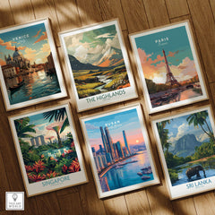 Set of six framed travel posters featuring Venice, Paris, Singapore, Busan, The Highlands, and Sri Lanka, displayed on a wooden floor.
