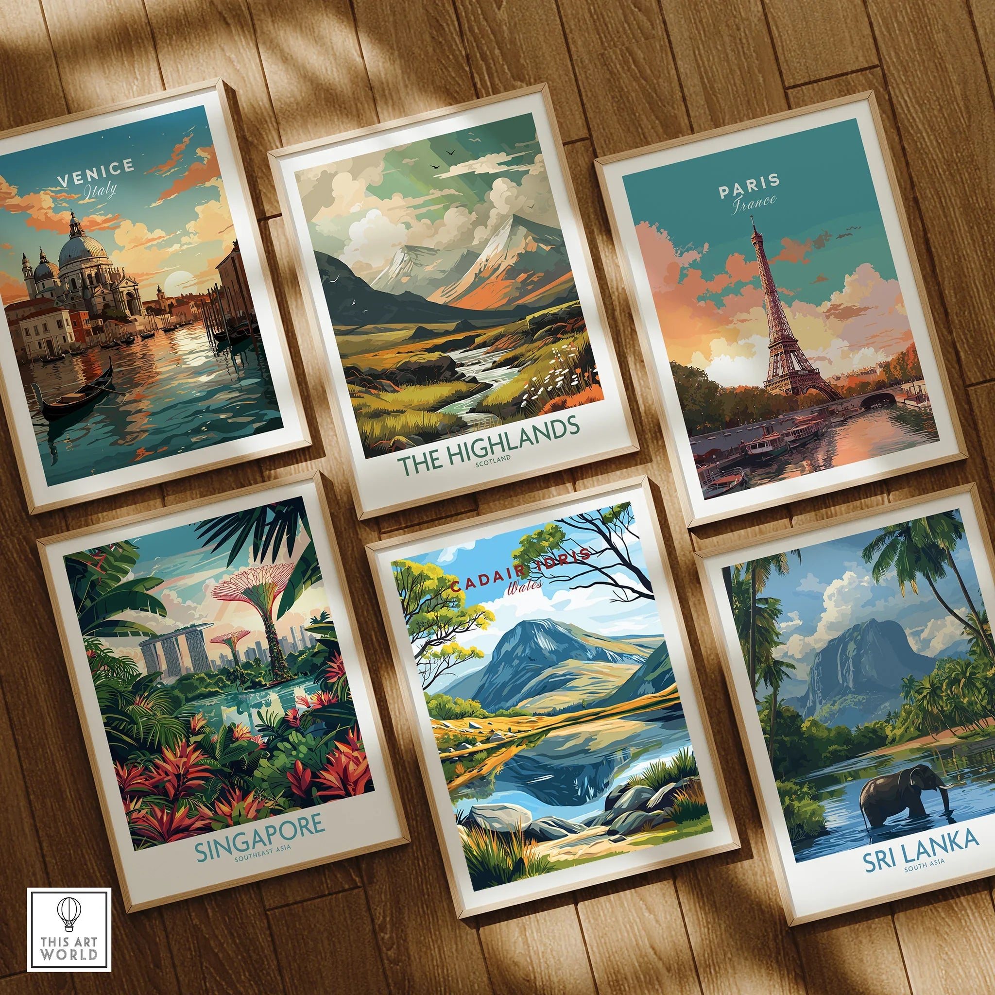 Set of six framed travel posters including Venice, Paris, Singapore, and scenic landscapes on wooden floor