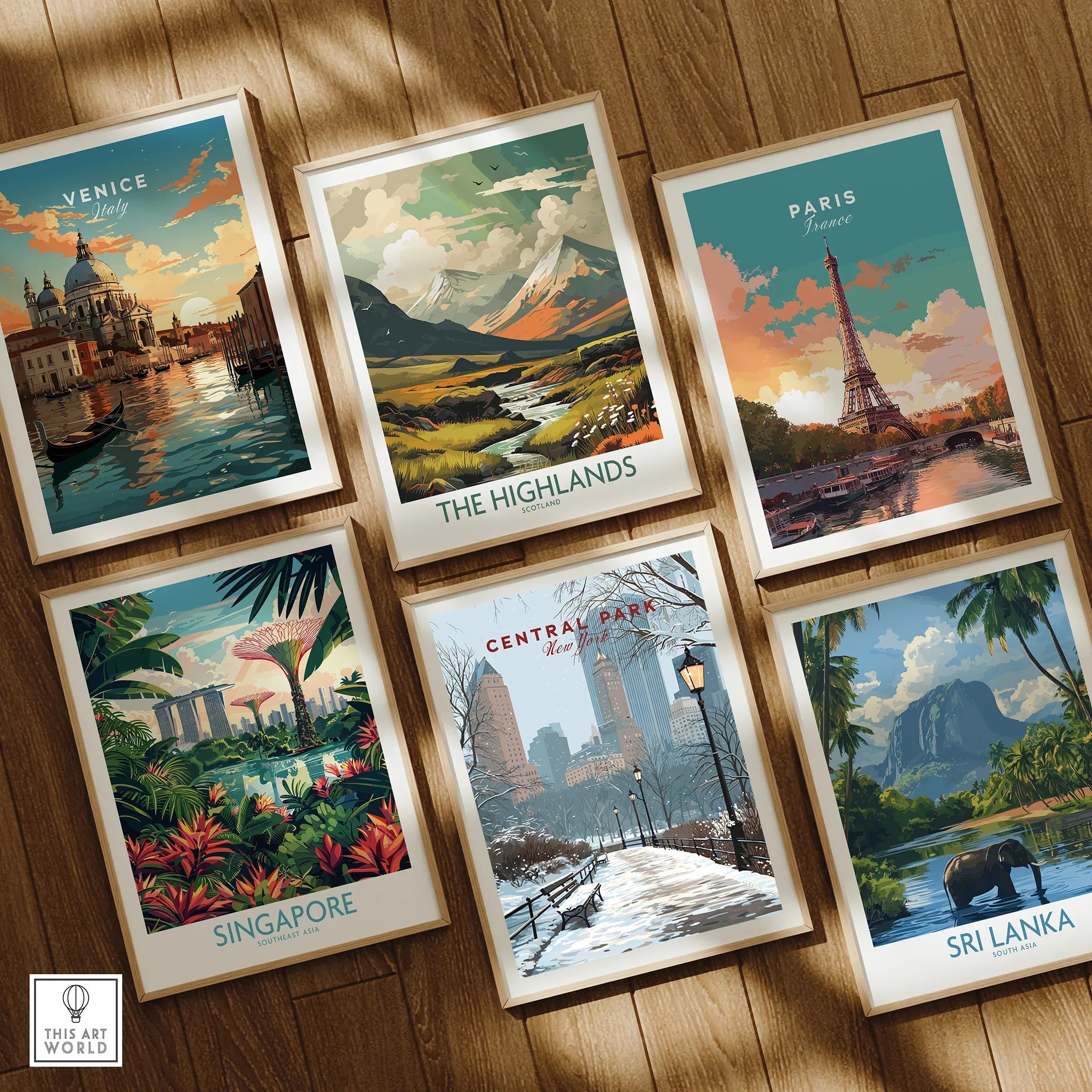 Set of six framed travel posters featuring Venice, Highlands, Paris, Singapore, Central Park, and Sri Lanka on wooden floor