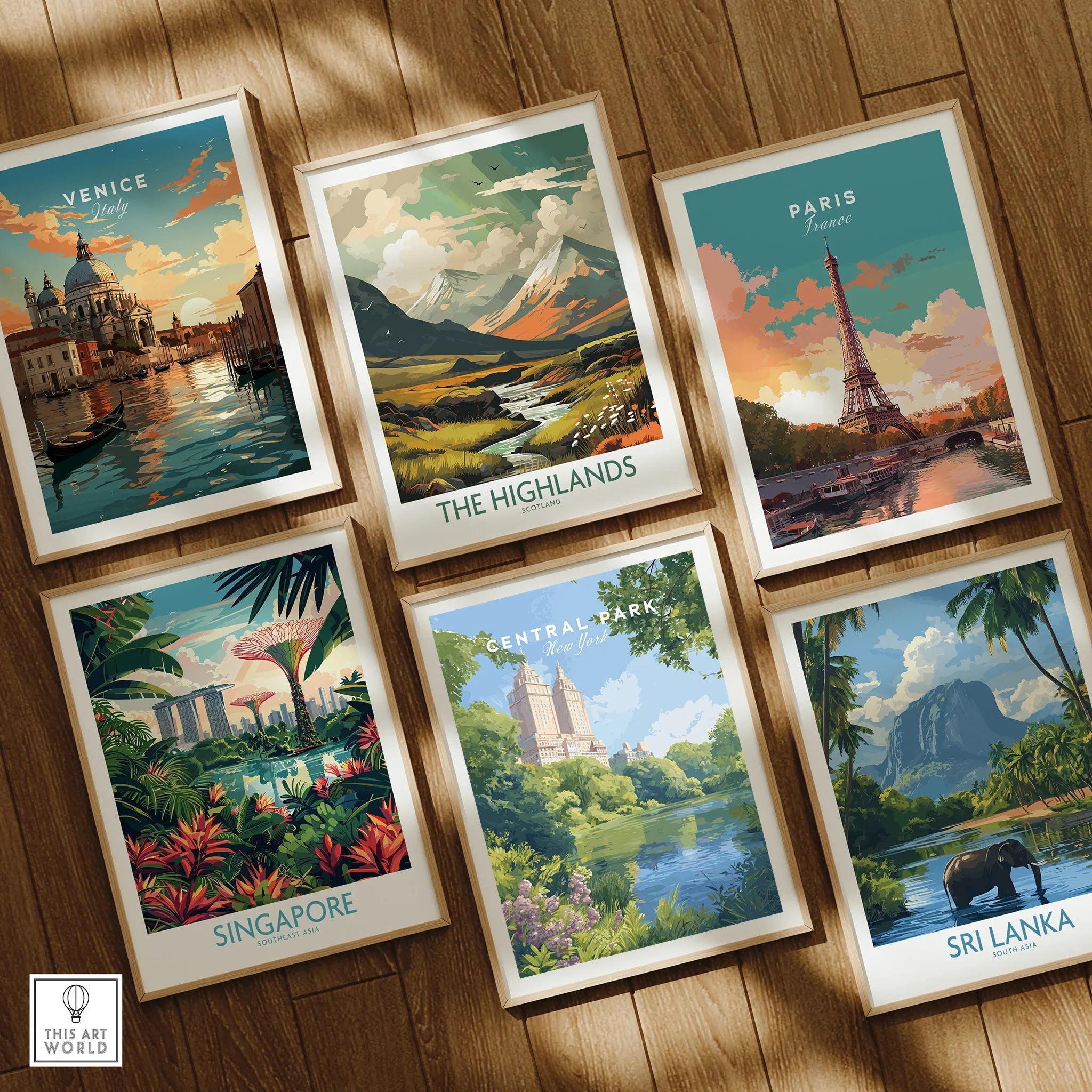 Set of six framed art prints featuring travel posters for Venice, the Highlands, Paris, Singapore, Central Park, and Sri Lanka on a wooden floor.