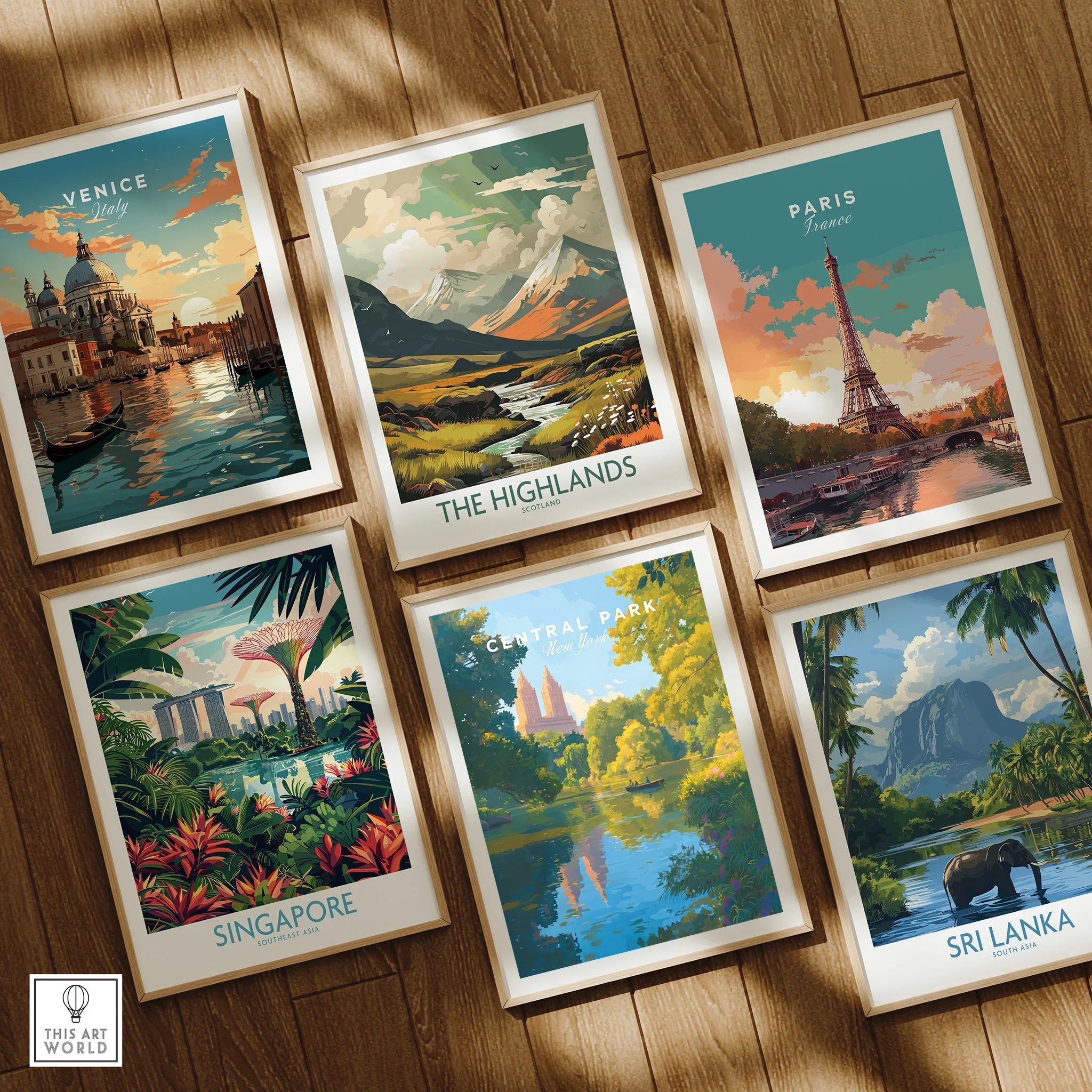 Set of six framed travel art prints, featuring Venice, Paris, Singapore, Central Park, The Highlands, and Sri Lanka, displayed on a wooden floor.