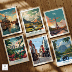 Set of six framed travel posters featuring Venice, Paris, Scotland, Singapore, Colchester, and Sri Lanka on a wooden floor.