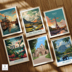 Set of six framed travel art prints featuring Venice, The Highlands, Paris, Singapore, Colchester, and Sri Lanka on wooden floor.