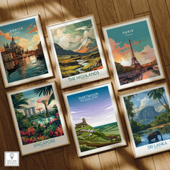Set of six framed travel poster art prints featuring Venice, The Highlands, Paris, Singapore, Dartmoor National Park, and Sri Lanka on a wooden floor.