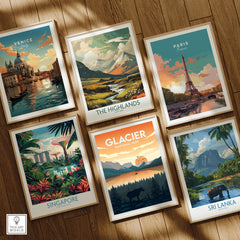 Set of six framed travel posters on wooden floor, featuring Venice, Paris, Singapore, Glacier National Park, The Highlands, and Sri Lanka landscapes.