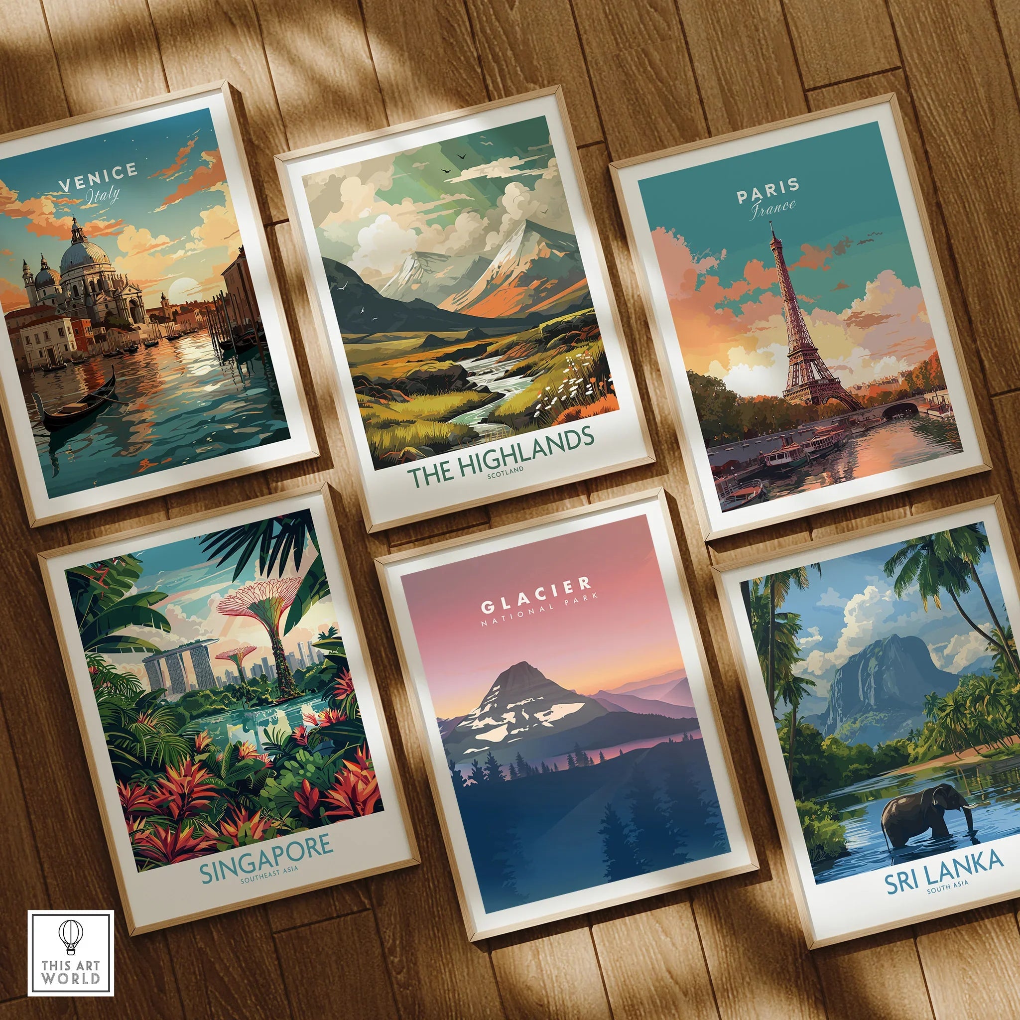 Set of six framed travel and national park art prints on a wooden floor