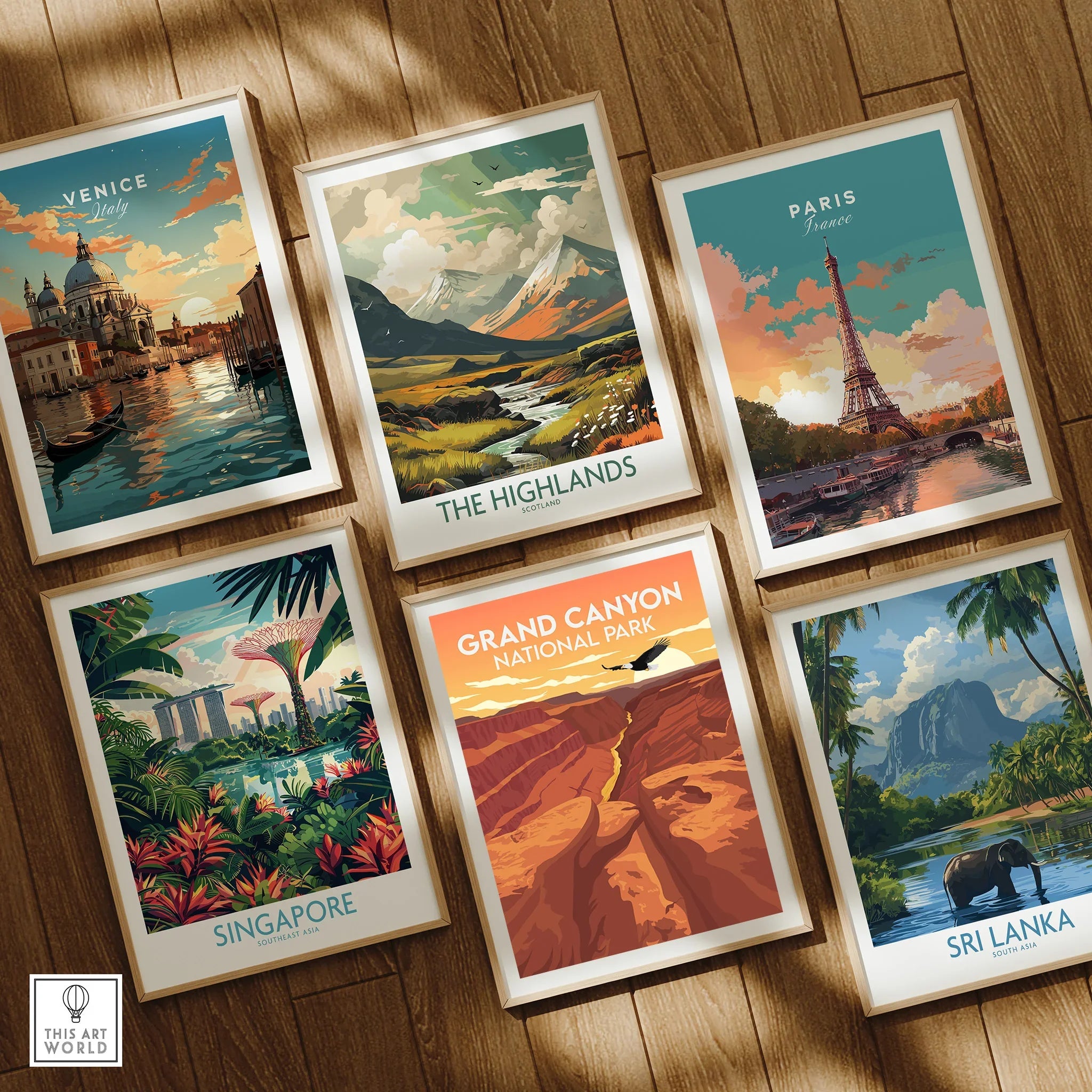Set of six framed travel art prints featuring Venice, Paris, The Highlands, Singapore, Grand Canyon, and Sri Lanka on a wooden floor.