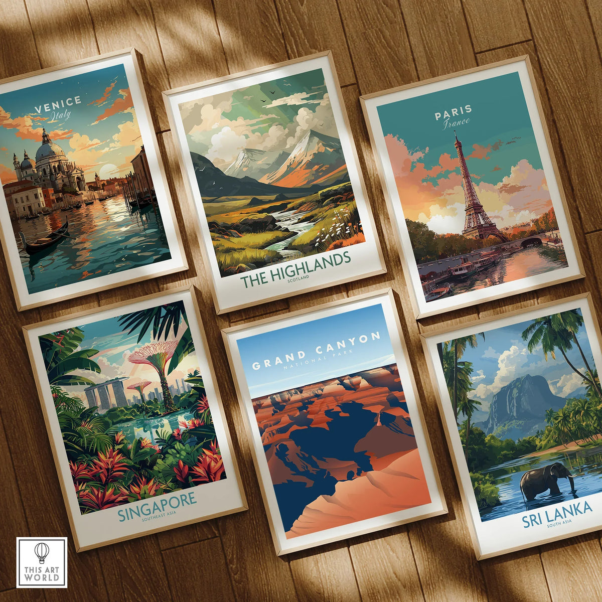 Set of six framed travel art prints featuring Venice, Paris, Highlands, Singapore, Grand Canyon, and Sri Lanka on a wooden floor.