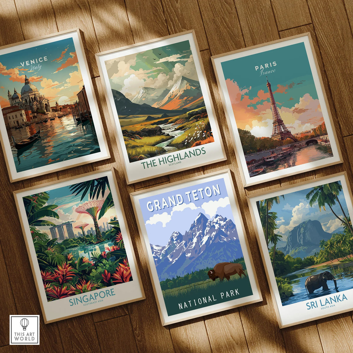 Set of six framed travel art prints featuring Venice, Paris, Singapore, Highlands, Grand Teton, and Sri Lanka on a wooden floor.