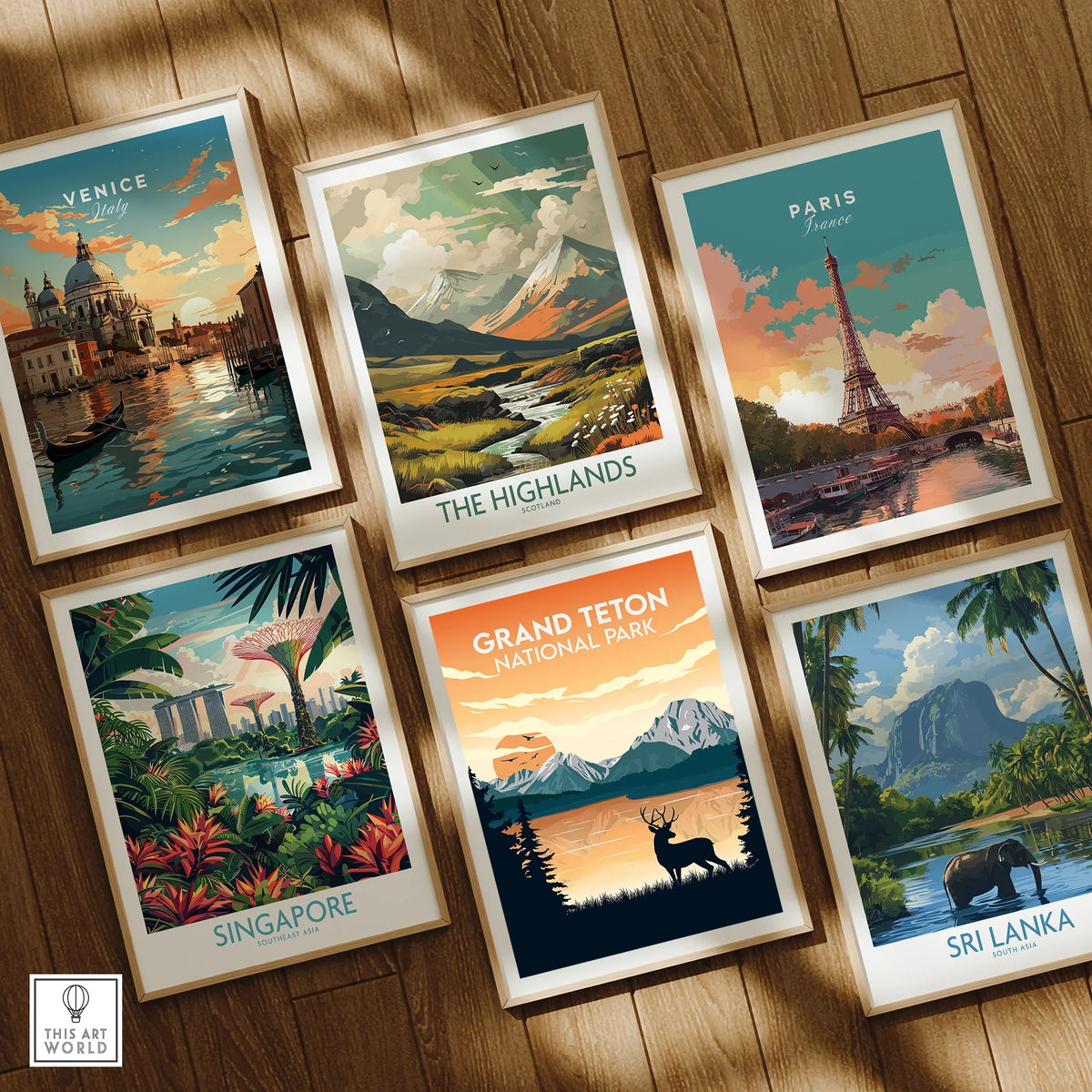 Set of six framed travel and national park art prints on wooden floor, featuring Venice, the Highlands, Paris, Singapore, Grand Teton, and Sri Lanka.