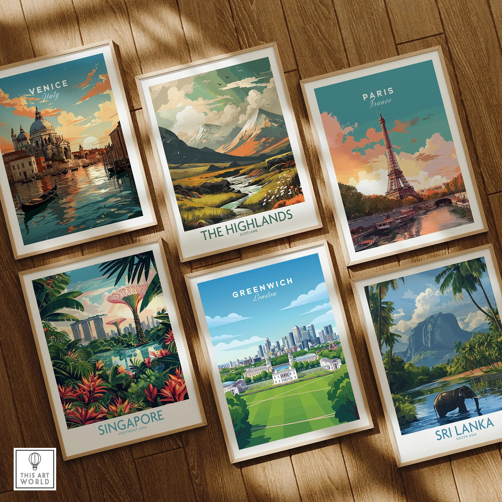 Set of six framed travel posters featuring Venice, Paris, Highlands, Singapore, Greenwich, Sri Lanka on wooden floor