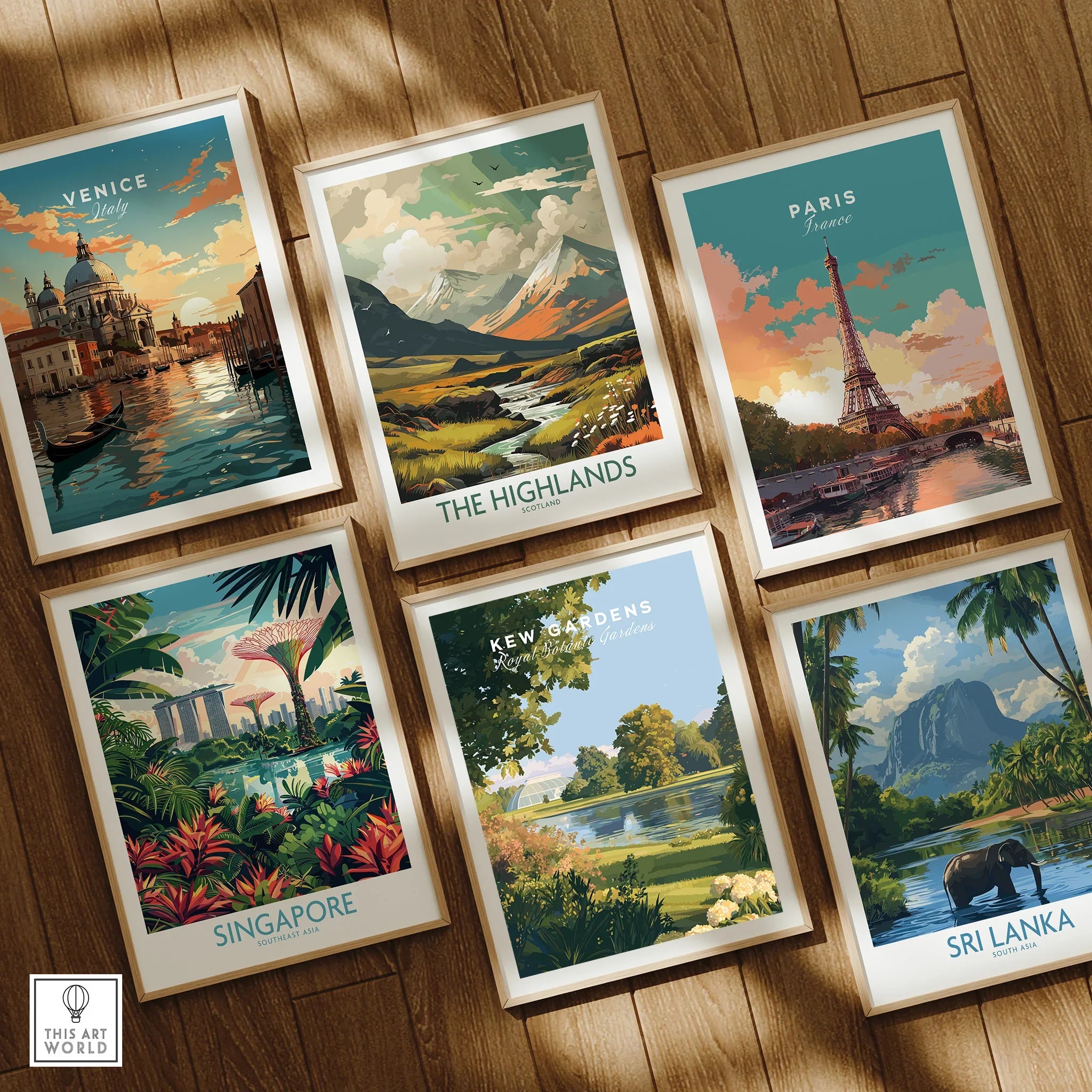 Set of six framed travel posters featuring Venice, Paris, Highlands, Singapore, Kew Gardens, Sri Lanka, displayed on a wooden floor