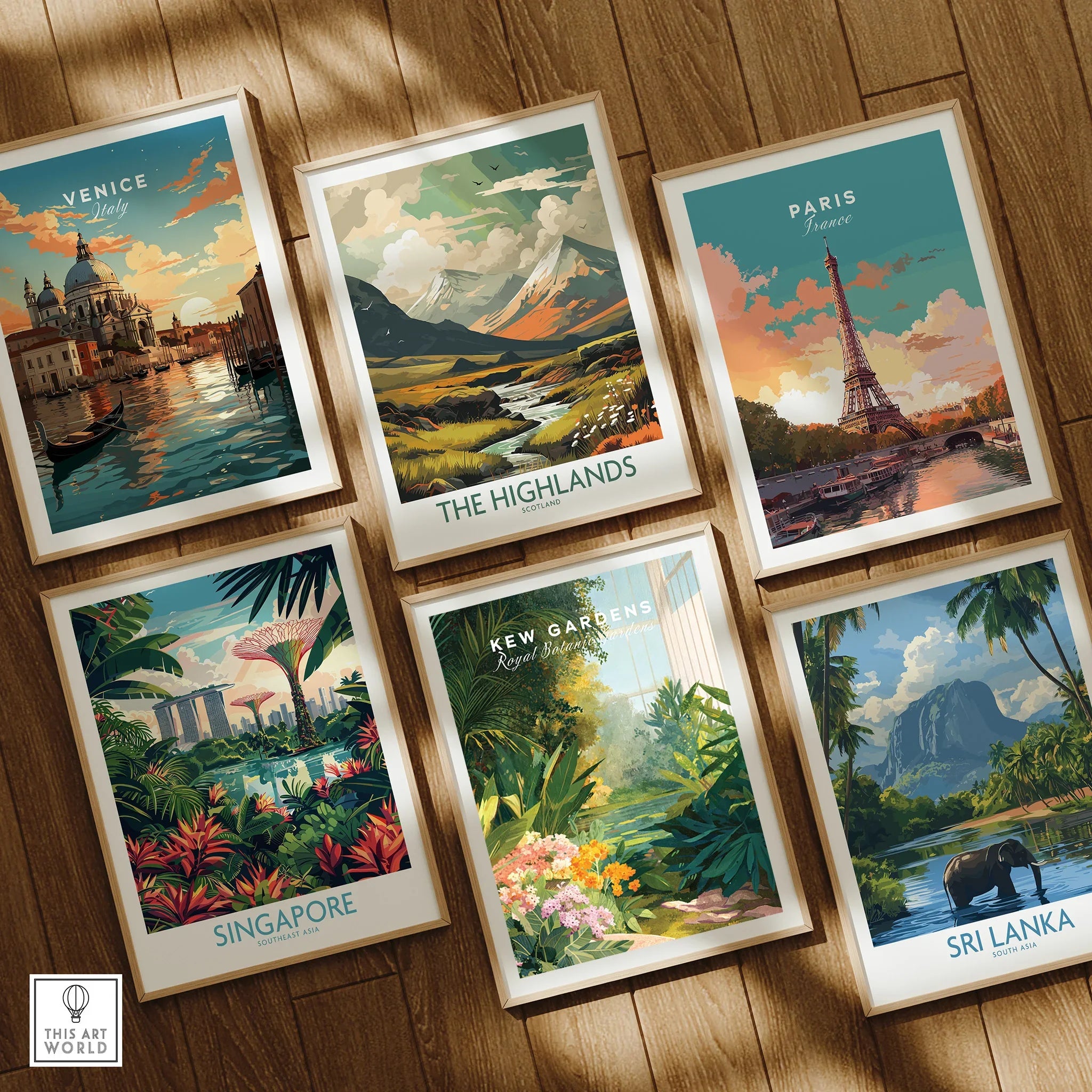 Set of six framed travel art prints featuring Venice, The Highlands, Paris, Singapore, Kew Gardens, and Sri Lanka, displayed on a wooden floor in natural wood frames.