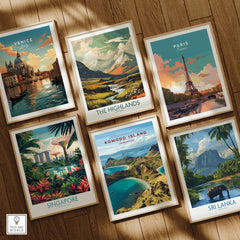 Set of six framed travel posters featuring Venice, Paris, The Highlands, Singapore, Komodo Island, and Sri Lanka, displayed on a wooden floor.